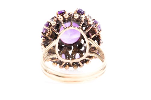 Lot 217 - A amethyst and diamond cluster cocktail ring,...