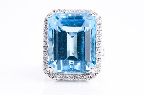 Lot 366 - A blue topaz and diamond dress ring, the...