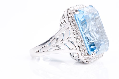 Lot 366 - A blue topaz and diamond dress ring, the...