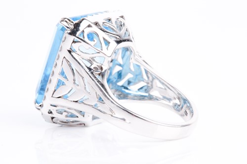 Lot 366 - A blue topaz and diamond dress ring, the...