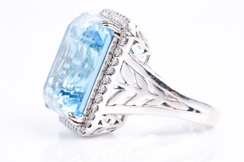 Lot 366 - A blue topaz and diamond dress ring, the...