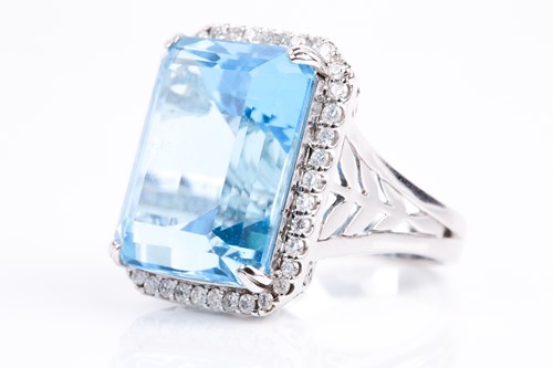 Lot 366 - A blue topaz and diamond dress ring, the...