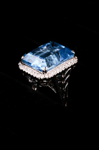 Lot 366 - A blue topaz and diamond dress ring, the...