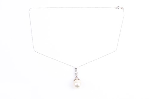 Lot 4 - A South Sea pearl and diamond pendant, the...