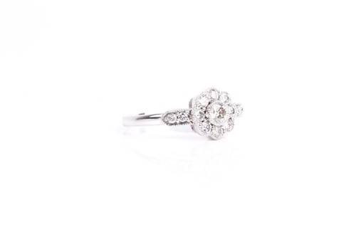 Lot 122 - A diamond cluster ring, the principle...