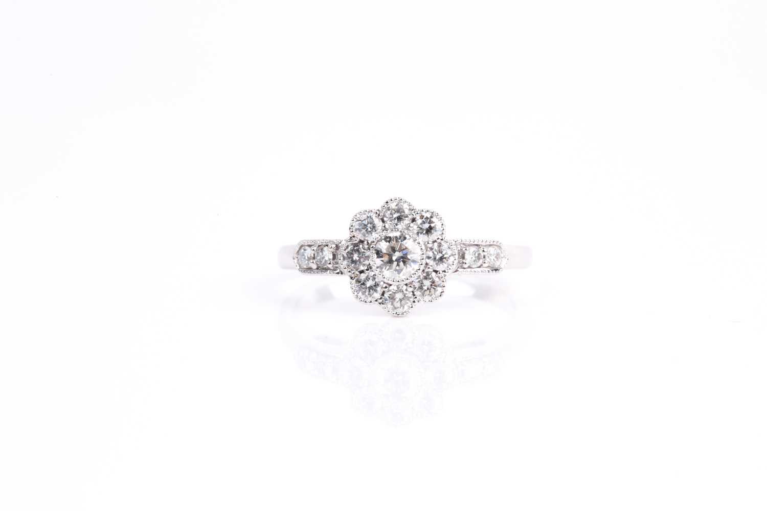 Lot 122 - A diamond cluster ring, the principle...
