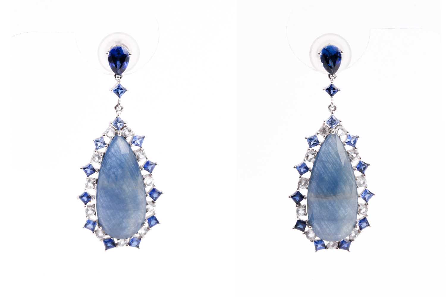 Lot 138 - A pair of sapphire pendant earrings, the...