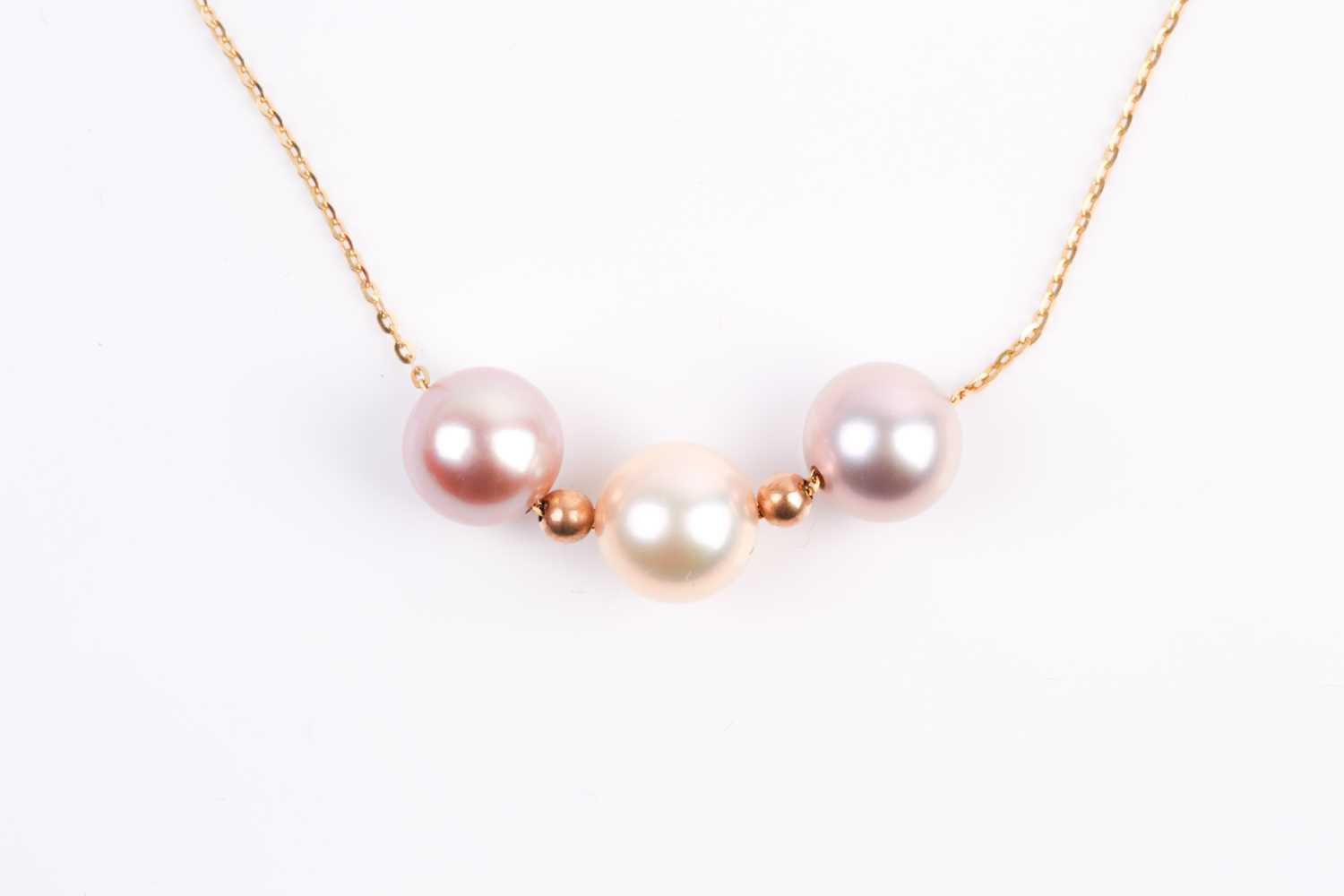 Lot 5 - A three stone mixed colour cultured pearl...