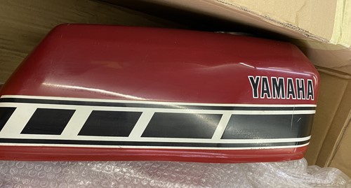 Lot 35 - Two Yamaha red fuel tanks.