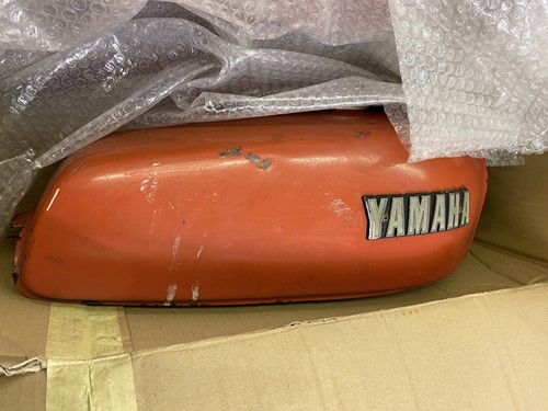 Lot 35 - Two Yamaha red fuel tanks.