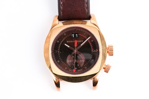 Lot 476 - A Burberry gold-plated dress watch with brown...