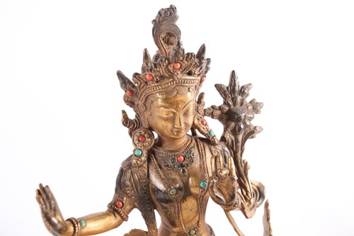 Lot 108 - A possibly Tibetan gilt bronze seated...