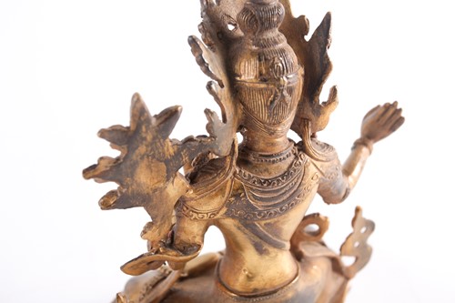 Lot 108 - A possibly Tibetan gilt bronze seated...