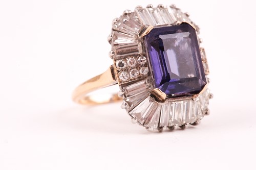 Lot 119 - A diamond and iolite dress ring, the step cut,...