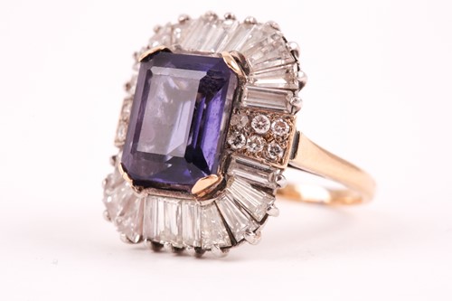 Lot 119 - A diamond and iolite dress ring, the step cut,...