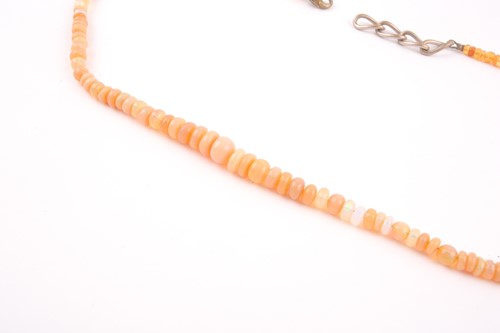 Lot 10 - A opal bead necklace, the graduated roundels...