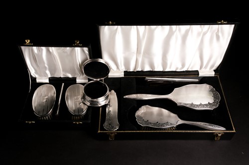 Lot 579 - A 20th century cased silver-backed dressing...