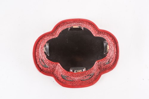 Lot 111 - A Chinese cinnabar lacquer bowl, of shaped...