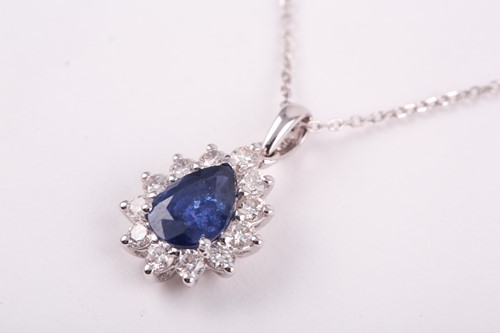 Lot 234 - An 18ct white gold, diamond, and sapphire...