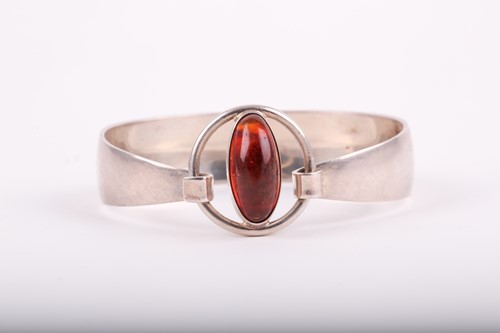Lot 351 - A Danish sterling silver and amber bangle, by...