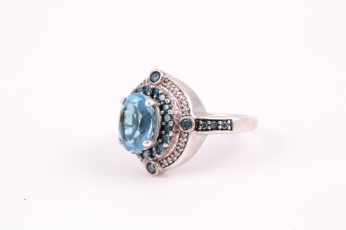 Lot 91 - A silver, topaz, and diamond ring, set with a...