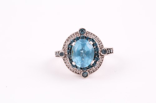 Lot 91 - A silver, topaz, and diamond ring, set with a...