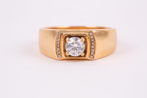 Lot 267 - A yellow metal and diamond ring, set with a...