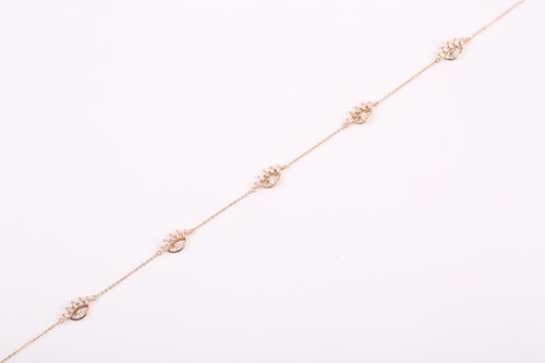 Lot 310 - An 18ct yellow gold and diamond necklace, the...