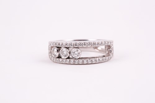 Lot 305 - Messika. An 18ct white gold and diamond ring,...