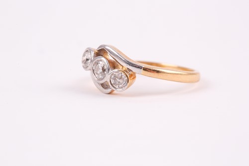 Lot 64 - An 18ct yellow gold and diamond crossover ring,...
