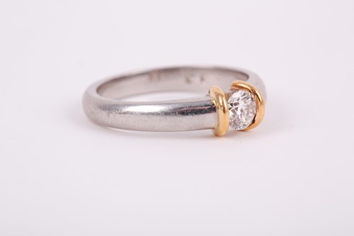 Lot 196 - A platinum and diamond ring, set with a round...