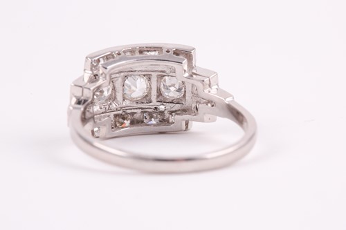 Lot 71 - A platinum and diamond ring, set with three...