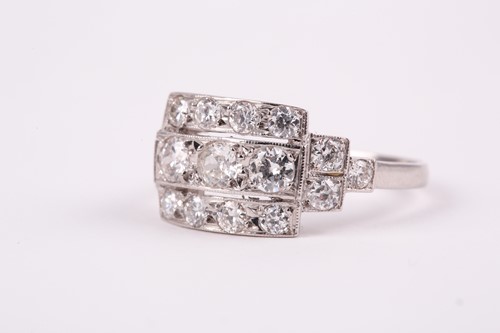 Lot 71 - A platinum and diamond ring, set with three...