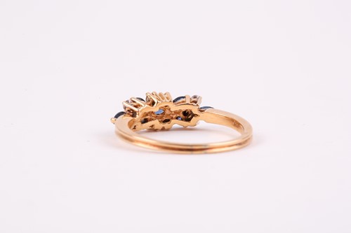 Lot 174 - An 18ct yellow gold, diamond, and sapphire...