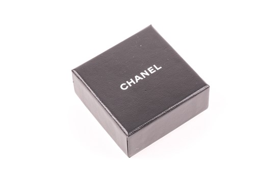 Lot 134 - Chanel. A pair of black Gripoix Camellia...