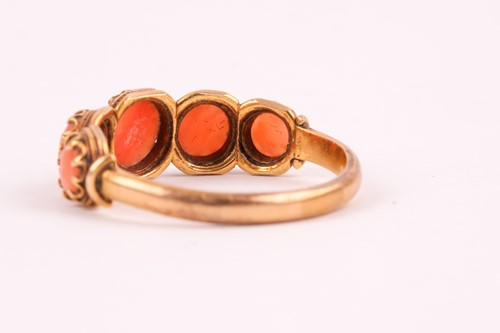 Lot 110 - A Georgian yellow gold and coral ring, set...