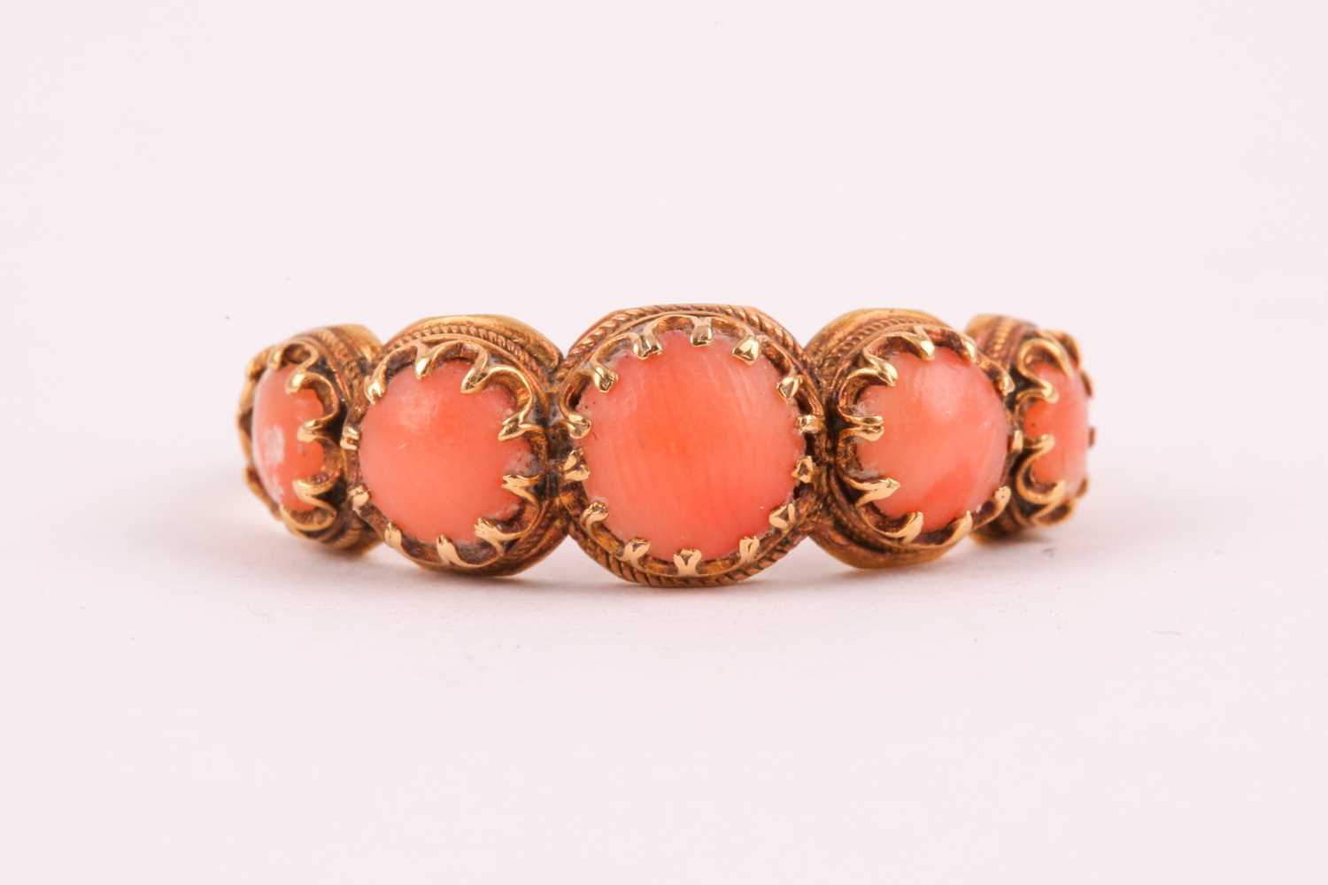 Lot 110 - A Georgian yellow gold and coral ring, set...