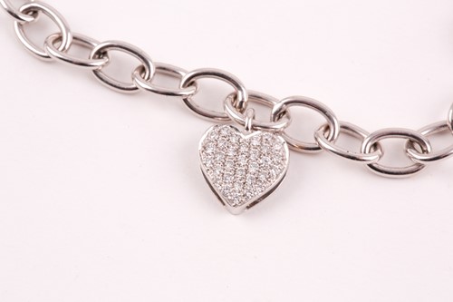 Lot 229 - An 18ct white gold charm bracelet, suspended...