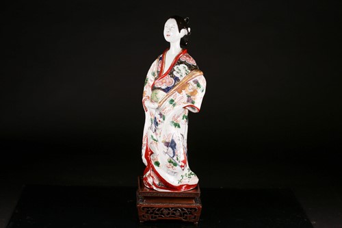 Lot 119 - A Japanese Edo period porcelain figure of a...