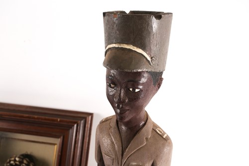 Lot 227 - An East African Askari figure, with peaked cap,...