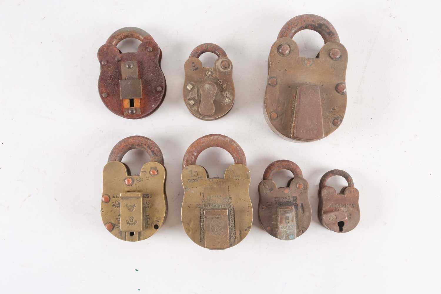 Lot 400 - Six brass cased padlocks, early 20th century,
