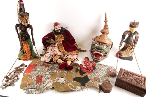 Lot 401 - Three Balinese puppets, a large shadow puppet,...