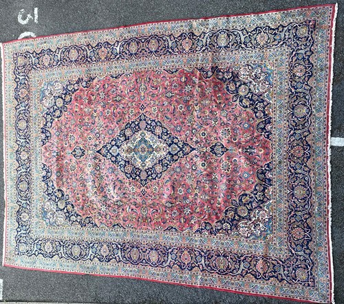 Lot 317 - A 20th century Kashan carpet with a central...