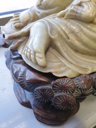 Lot 128 - A large Chinese carved green soapstone figure...