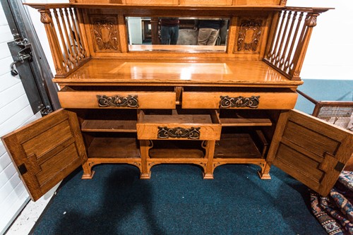 Lot 291 - An early 20th century golden oak arts and...