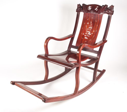 Lot 250 - A contemporary Chinese hardwood rocking chair,...
