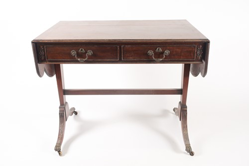 Lot 295 - A George III style, mahogany two flap sofa...
