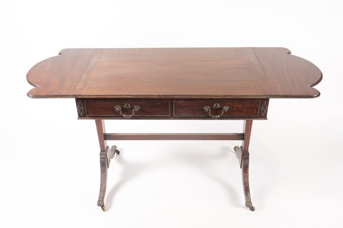 Lot 295 - A George III style, mahogany two flap sofa...