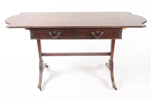 Lot 295 - A George III style, mahogany two flap sofa...