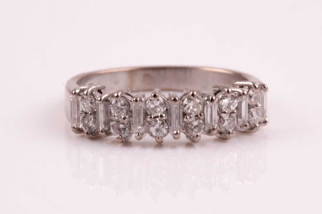 Lot 187 - A diamond half hoop eternity ring, set with...